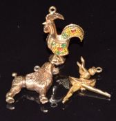 A 9ct gold charm/ pendant in the form of a cockerel with enamel decoration, a 9ct gold ballerina