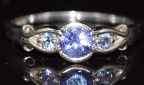 A 9ct white gold ring set with three tanzanites, 2.4g, size N