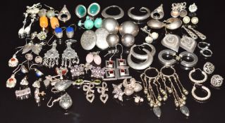 Forty pairs of silver earrings including marcasite, amethyst, quartz, Greek key, etc