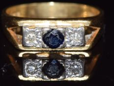 An 18ct gold ring set with a sapphire and diamonds, 5.9g, size N