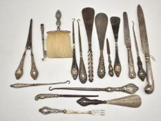 Eighteen hallmarked silver handled knives, crumb brush, button hooks etc, length of longest 28cm