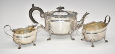 Hukin & Heath Edward VII hallmarked silver three piece teaset with shaped edges and raised on four