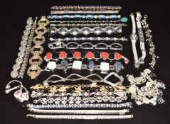 Twenty five silver bracelets including synthetic purple sapphires, peridot, amethyst, filigree,