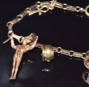 An Austrian 15ct gold bracelet with eight charms including 9ct gold pram, 9ct gold cot, 9ct gold