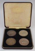 A cased set of four crowns comprising 1937 Australian example, two Victorian 1893 and 1899 and