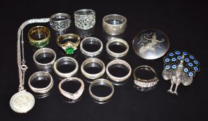 A collection of silver jewellery including fifteen rings, brooch, Siam brooch and St Christopher