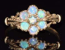 A 9ct gold ring set with opals in a cluster, 1.6g, size R
