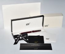 Montblanc ballpoint pen with maroon body and chrome fittings, in original box with warranty card,