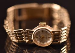 Rotary 9ct gold ladies wristwatch with gold hands and hour markers, silver dial and 21 jewel