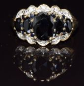 A 9ct gold ring set with sapphires and diamonds, 4.1g, size M