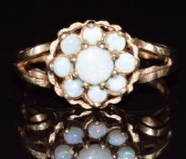A 9ct gold ring set with a cluster of opals, 2.7g, size N