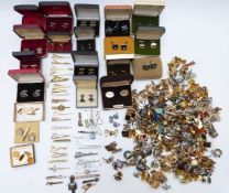 A large collection of cufflinks and tie clips including mother of pearl, rolled gold, bloodstone,