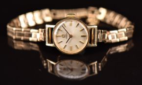 Omega 9ct gold ladies wristwatch ref. 5115642 with black hands, gold hour markers, silver dial and