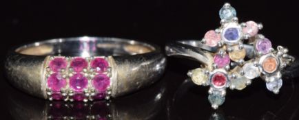Two 9ct white gold rings, one set with rubies the other with multi coloured sapphires, 6.2g, size