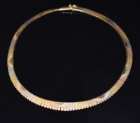 An 18ct gold tricoloured necklace with textured links, 39.7g, 44cm long