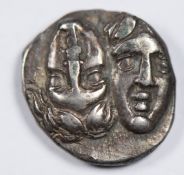 Greece, Istros 400-350BC AR States obv. facing busts invested rev. eagle flying left with fish in