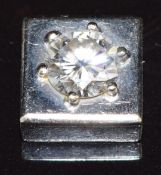 A 18k white gold pendant set with a round brilliant cut diamond of approximately 0.55ct, 1.5g