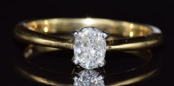 An 18ct gold ring set with an oval cut diamond of approximately 0.45ct, 3.5g, size P