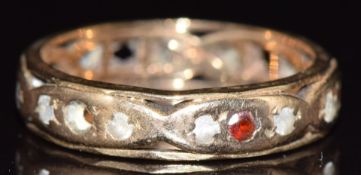 A 9ct gold eternity ring set with paste and spinel, 3.1g, size M