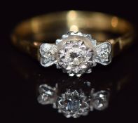 An 18ct gold ring set with three diamonds in platinum setting, 3.2g, size R