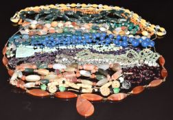 A collection of beaded necklaces including amber, bone and jet, agate, Egyptian glass, etc