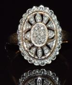 A 9ct gold ring set with diamonds in a pierced setting, 3.4g, size L