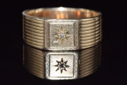 A 9ct gold ring set with a diamond in a star setting, 5.3g, size T