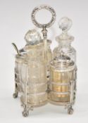 Victorian hallmarked silver and cut glass five bottle cruet on stand, raised on three ball and