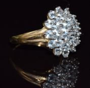 A 9ct gold ring set with a cluster of aquamarines, 3.3g, size N