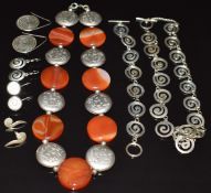 A suite of silver jewellery comprising necklace, bracelet and four pairs of earrings together with