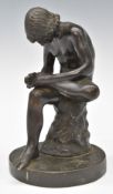 Bronze seated nude figure taking a thorn from his foot, on circular base, height 19cm