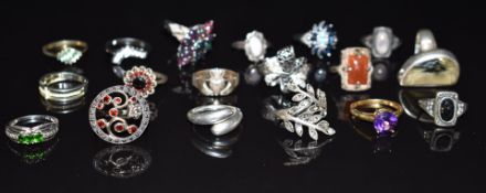 Seventeen silver rings including garnet, emerald, opal, etc