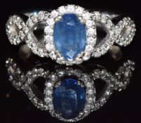 A 14k white gold ring set with a sapphire and diamonds, 4.7g, size M