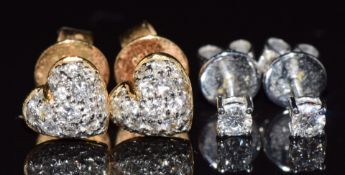 A pair of 14k white gold earrings, each set with a diamond of approximately 0.1ct (1.1g) and a