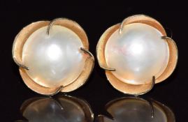 A pair of 9ct gold earrings set with a and pearl, 3.9g