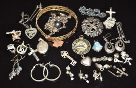 A collection of silver charms, silver locket, silver earrings, gold plated bangle, etc