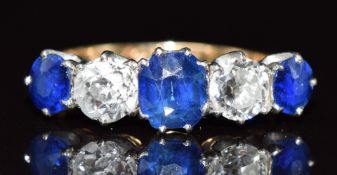 A c1920 18ct gold ring set with sapphires and diamonds, the centre sapphire approximately 0.6ct