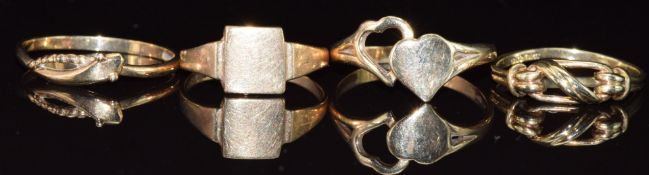 Four 9ct gold rings, one in the form of a serpent, 4.7g