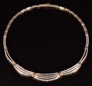 A 9ct gold necklace, each link set with swags of diamonds, 32g, 43cm long