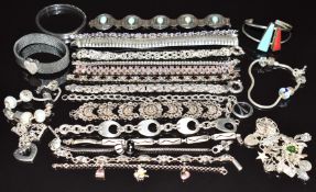 Eighteen silver bracelets including garnets, filigree, etc