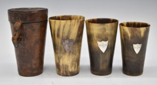 Cased set of three 19thC graduated horn hunting cups in leather case each cup with silver shield