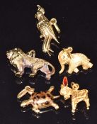Four 18ct gold charms including a turtle set with enamel, donkey with enamel ears, elephant with