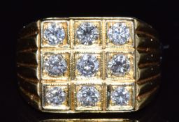 An 18ct gold ring set with nine diamonds totalling approximately 1ct, 9.9g, size Q