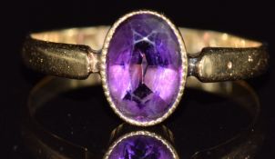 Edwardian 18ct gold ring set with an oval cut amethyst, Birmingham 1909, 2.2g, size N