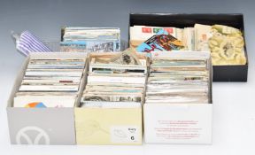 A large collection of loose postcards and postcard collecting accessories including humorous,