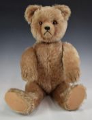 Schuco yes/no Teddy bear with label 'Harold Amer Teddy Bear', blonde mohair, shaved snout, straw