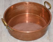 Copper preserving pan with twin brass handles, width 42cm