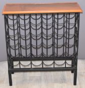 Cast iron thirty bottle wine rack with wooden top, W71 x D24 x H76cm