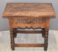 Antique possibly fruitwood side table with single drawer, raised on turned legs united by