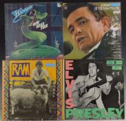 Approximately 140 albums including Johnny Cash, Elvis Presley, Bob Dylan, Buddy Holly, Eddie Cochran